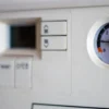 Combi boiler control panel with its pressure gauge