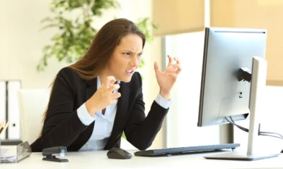 Frustrated woman looking at her computer screen