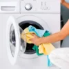 Woman loading clothes into a washing machine